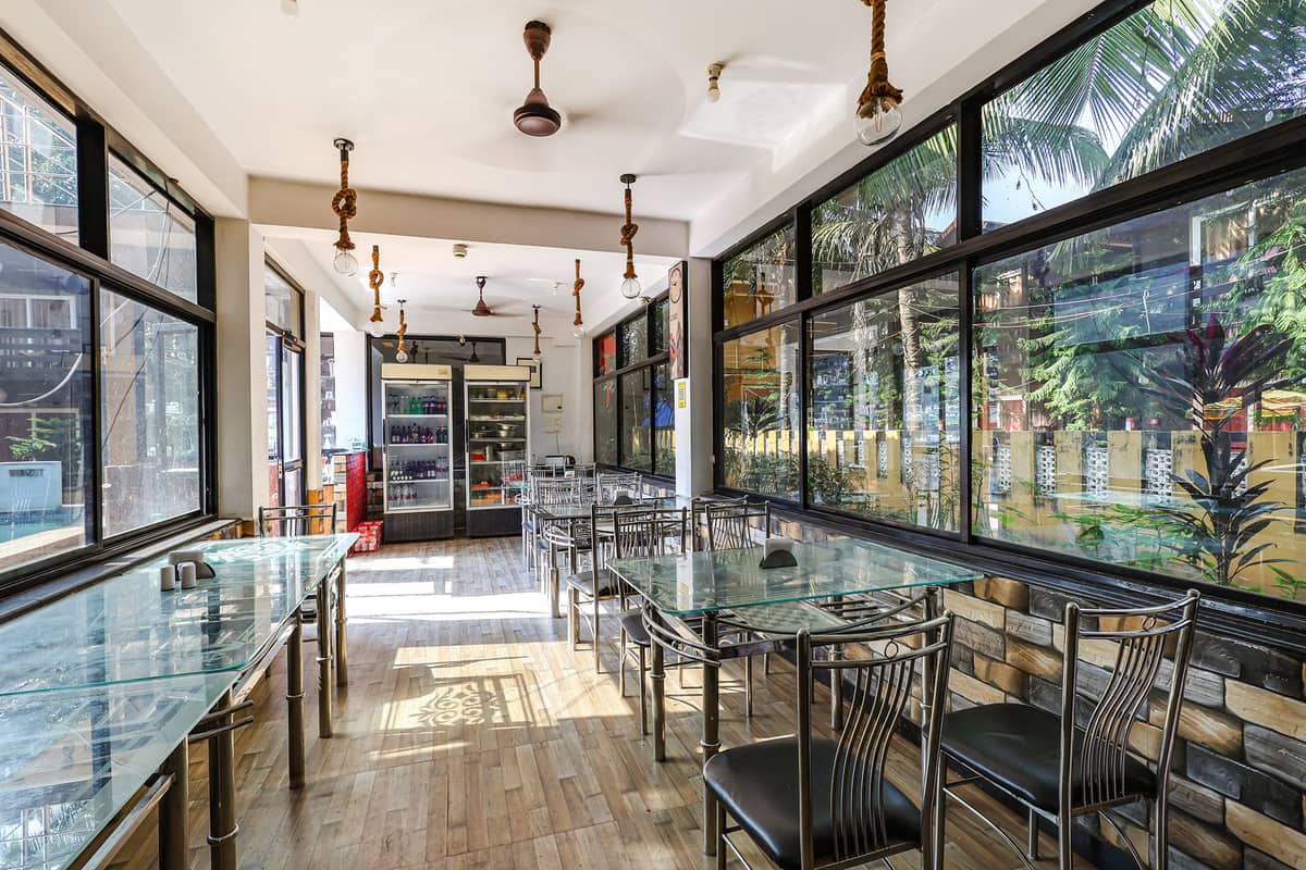 Airy glass-walled dining room